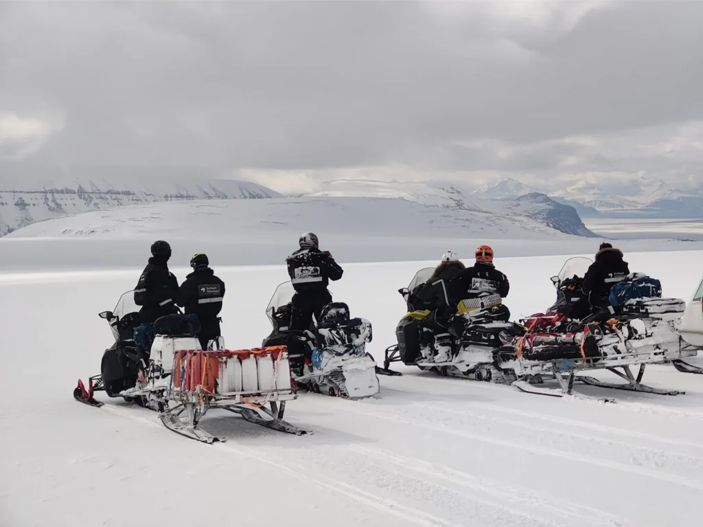 Visit Svalbard and drive a snowmobile to a magical ice cave