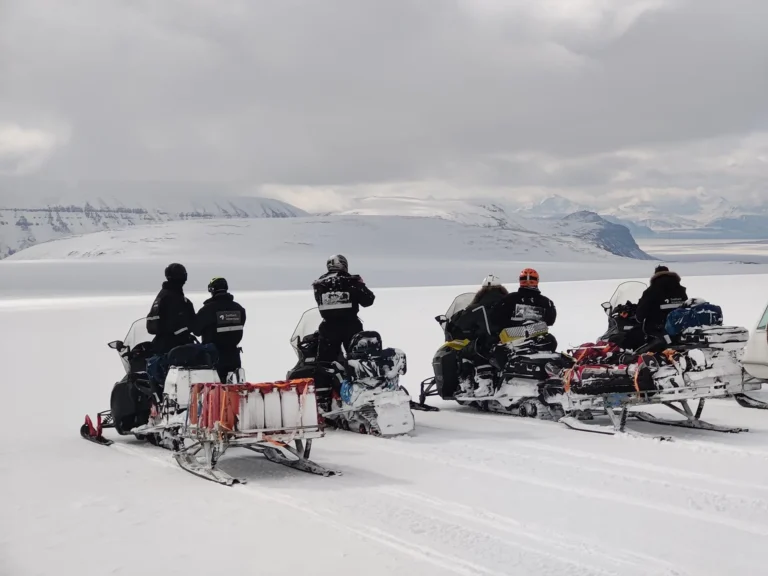 Ride a snowmobile to an ice cave in Svalbard