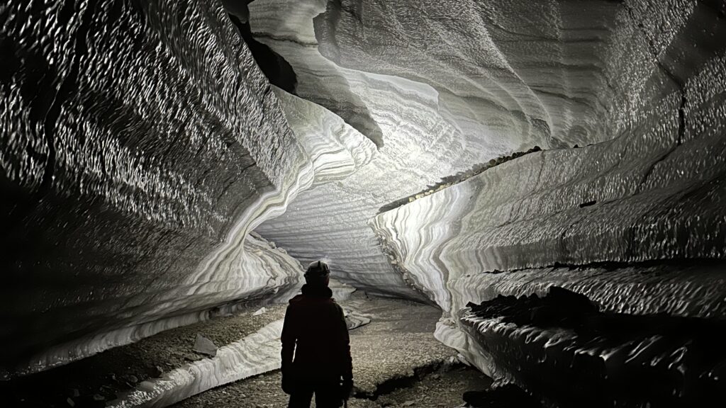 Hike to a magical ice cave in Svalbard
