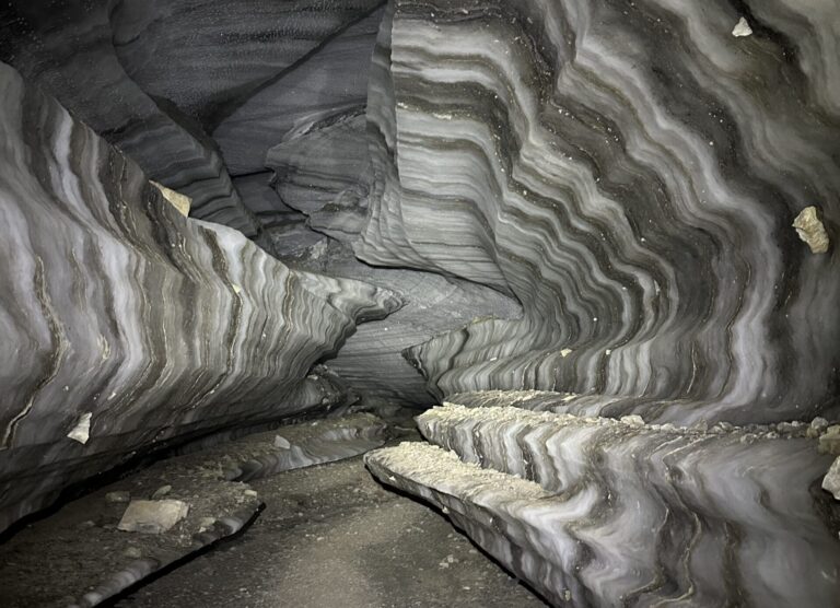 Go on an ice cave exploration starting with a hike