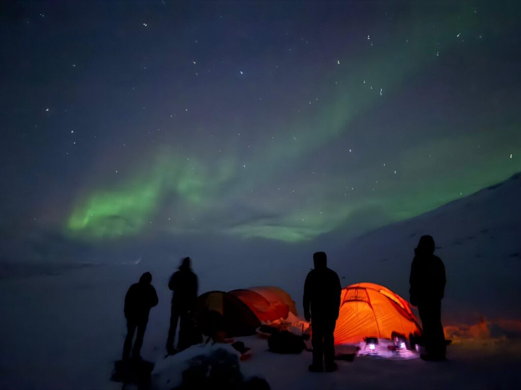 Spend one night outside in the Arctic wilderness under the northern lights or midnight sun
