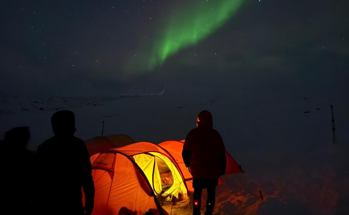 Northern lights or midnightsun above our one night in the Arctic camp in Svalbard
