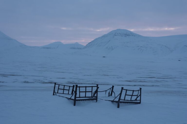 Visit the iron beds, ice cave and ride a snowmobile on this Svalbard adventure