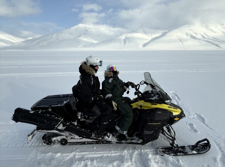 Adventure with snowmobile to ice cave on Svalbard