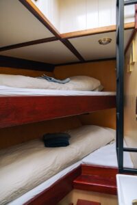 The interior view of the cozy cabins aboard the expedition ship Saeftinghe in Svalbard