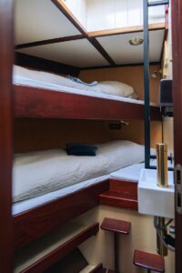 The interior view of the cozy cabins aboard the expedition ship Saeftinghe in Svalbard