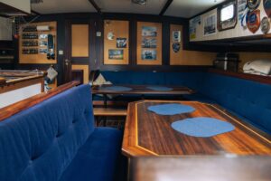 The interior view of the kitchen area and dining salon aboard the expedition ship Saeftinghe in Svalbard