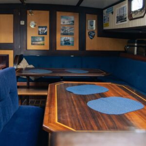 The interior view of the kitchen area and dining salon aboard the expedition ship Saeftinghe in Svalbard