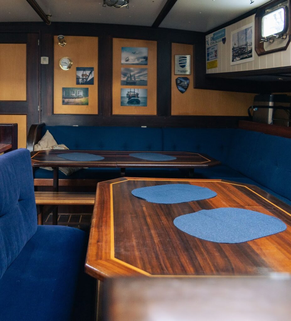 The interior view of the kitchen area and dining salon aboard the expedition ship Saeftinghe in Svalbard