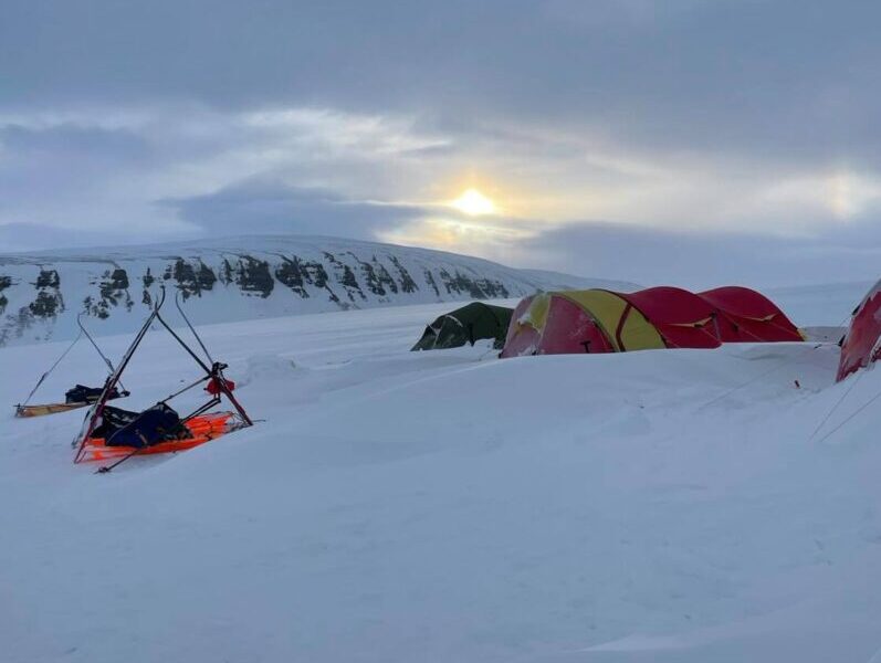 Campsite in the snow. Expeidition tents pitched in the snow during ta 4 day ski crossing across this coast to coast expedition with pulk