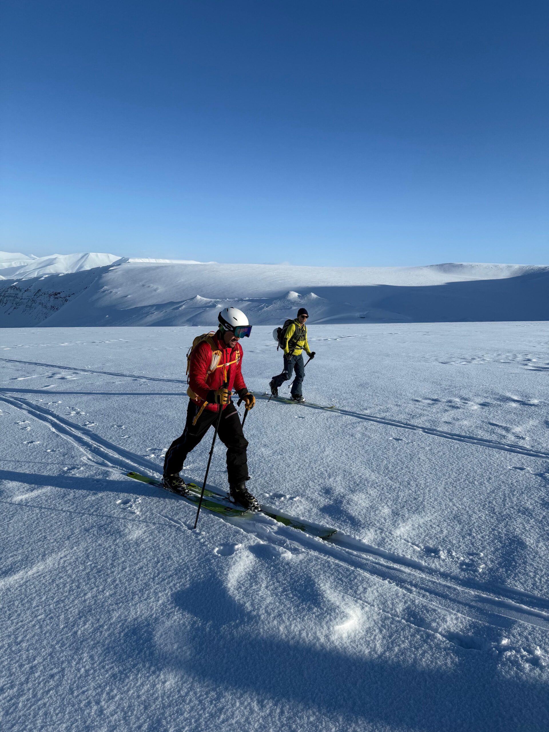 Experience the sunny winter ski touring in Svalbard with expert Arctic guides