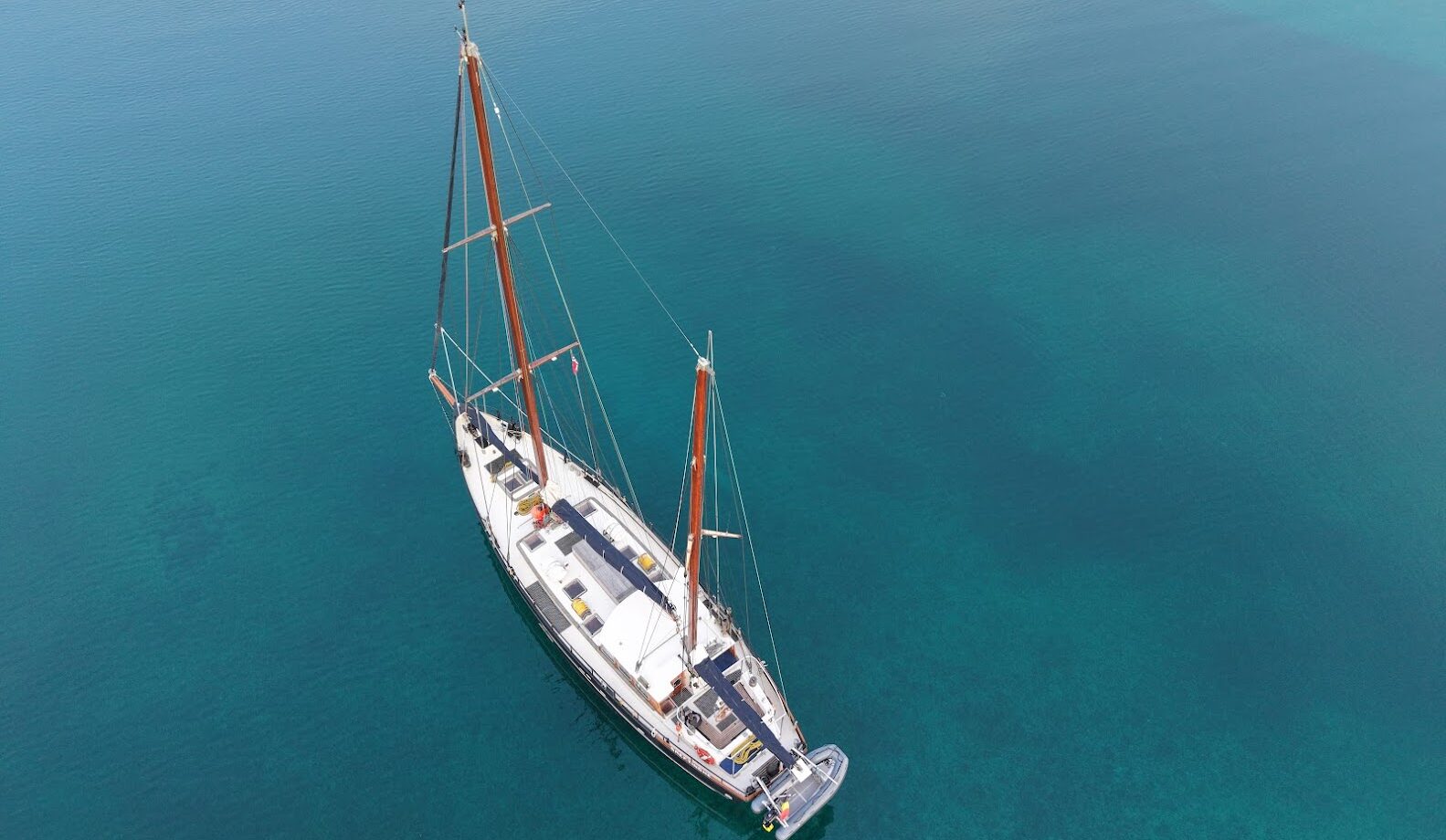The ship Saeftinghe for ski and sail expedition in Svalbard. Backcountry skiing on remote mountains.