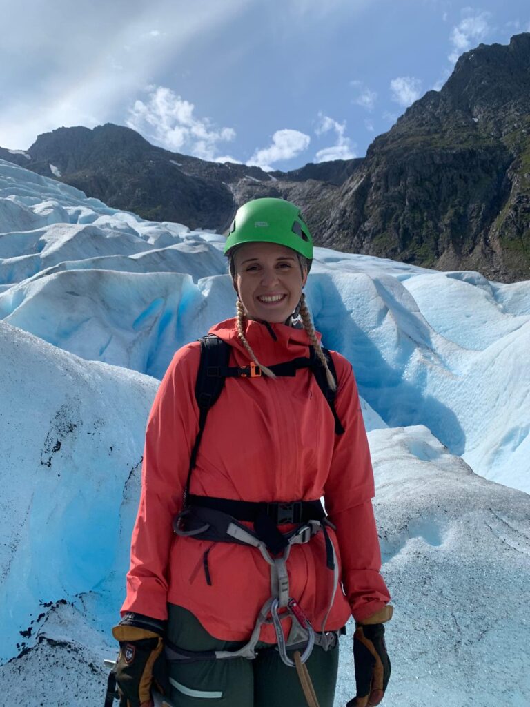 Guided tour hiking on an Arctic glacier using crampons and ice axes in Svalbard.