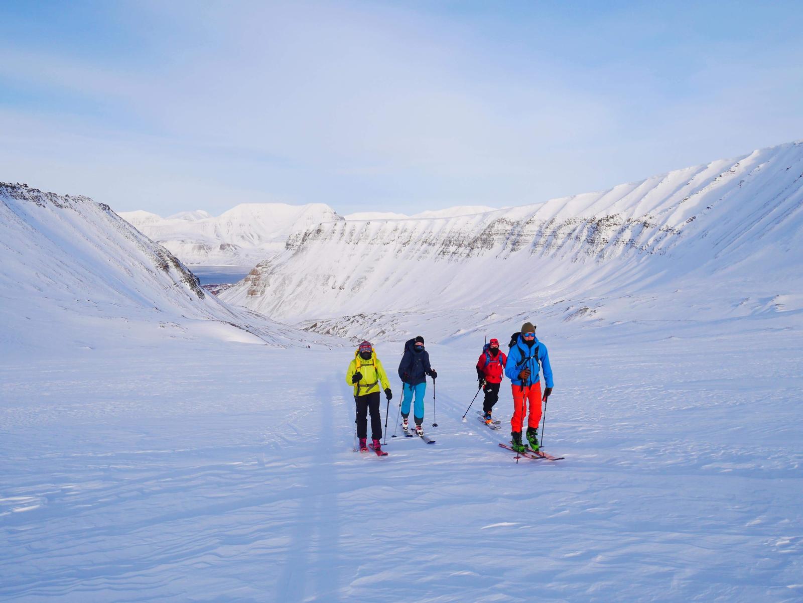 Ski touring on Nordenskiöld mountain near Longyearbyen during sunny winter season in Svalbard