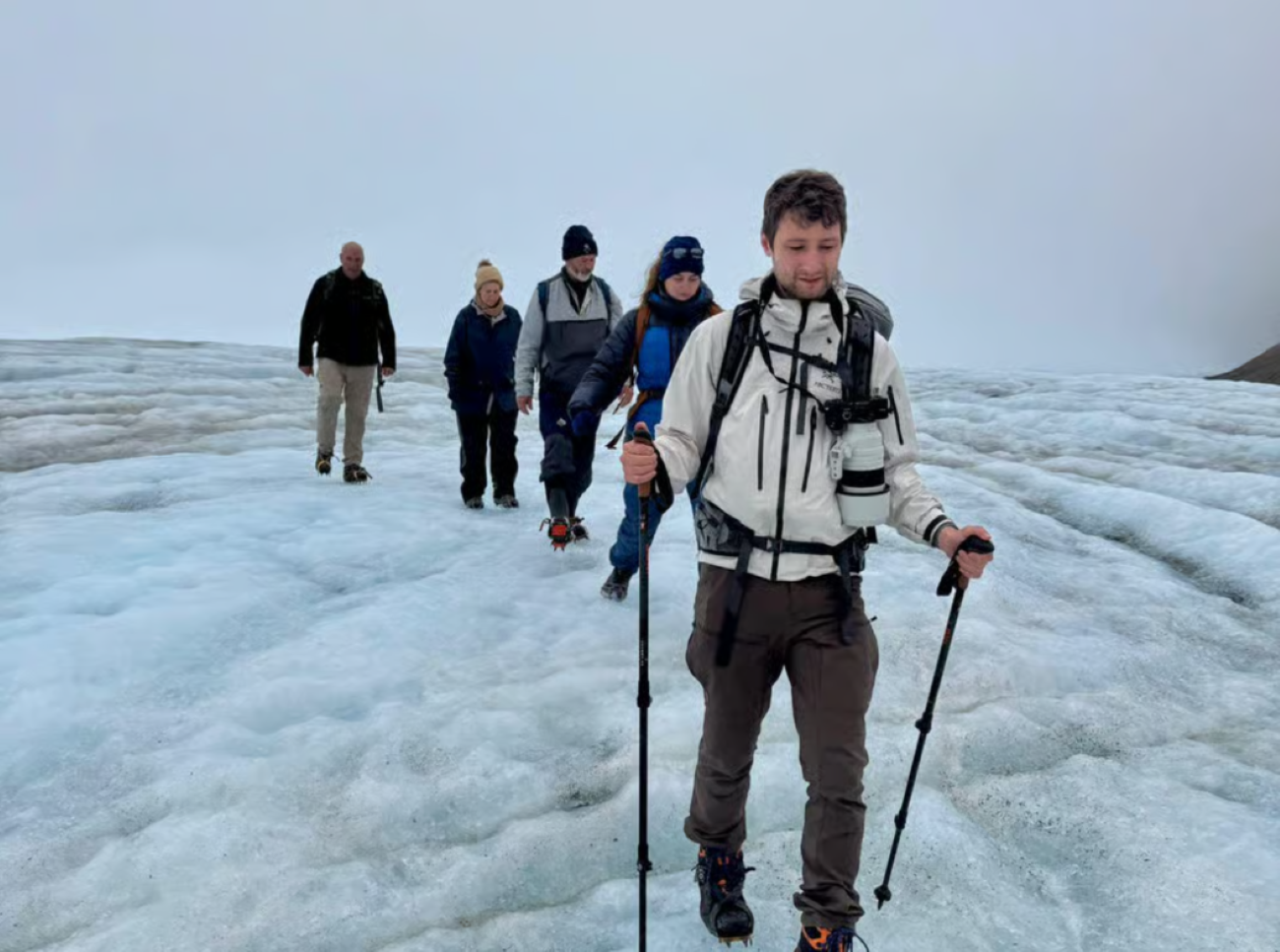 Walking on a Svalbard glacier with crampons