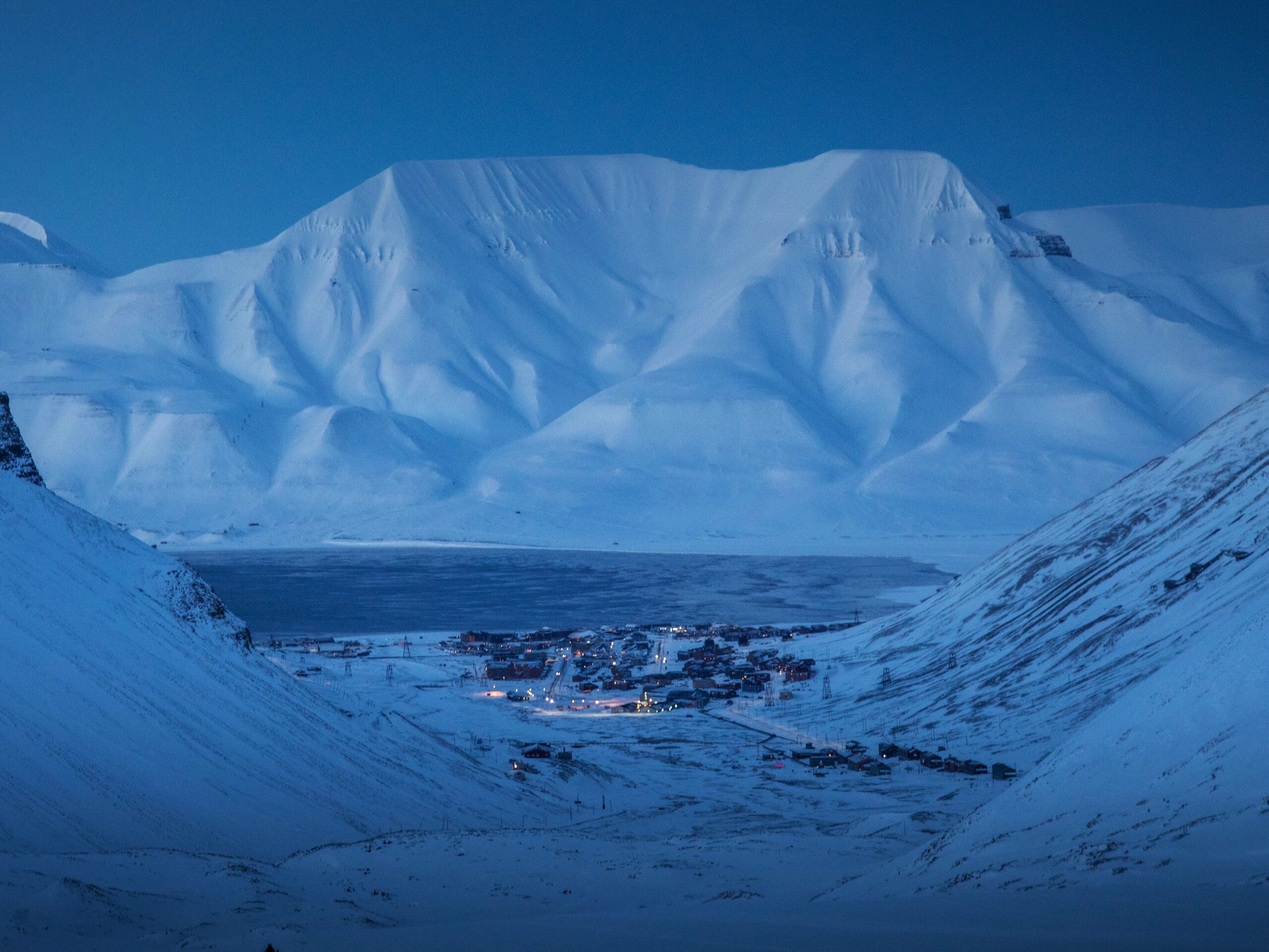 Enjoying the stunning view of Longyearbyen from the mountain returning from our ice cave hike