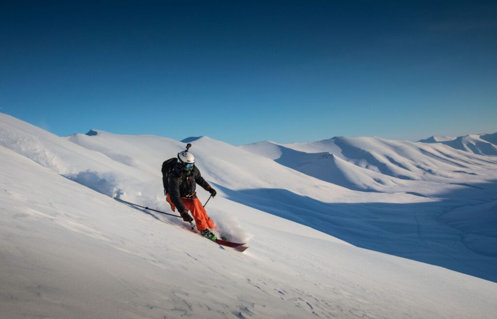 Svalbard ski touring with a skier in the backcountry mountains with Backyard Svalbard