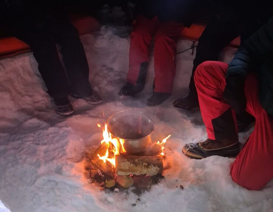 Sitting around the fire on the wilderness camp