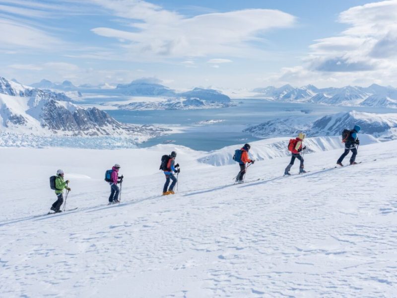 Escent and descent remote mountains on ski touring in the backcountry of Svalbard