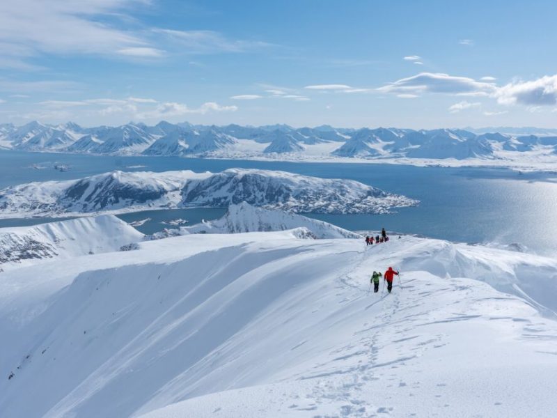 Sail along the coastline from fjord to fjord to ski touring from summit to sea with Backyard Svalbard