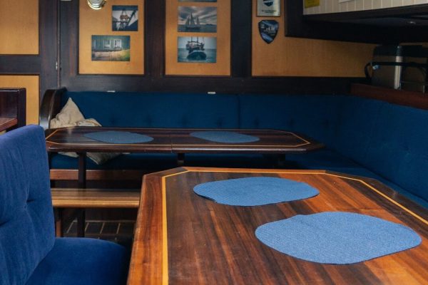 The interior view of the kitchen area and dining salon aboard the expedition ship Saeftinghe in Svalbard